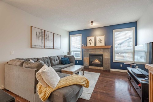 2937 Prairie Springs Grove Sw, Airdrie, AB - Indoor Photo Showing Living Room With Fireplace