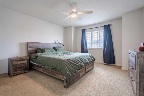 2937 Prairie Springs Grove Sw, Airdrie, AB - Indoor Photo Showing Bedroom