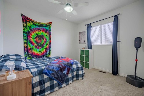 2937 Prairie Springs Grove Sw, Airdrie, AB - Indoor Photo Showing Bedroom