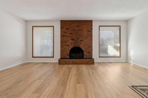 91 Edgehill Drive Nw, Calgary, AB - Indoor Photo Showing Living Room With Fireplace
