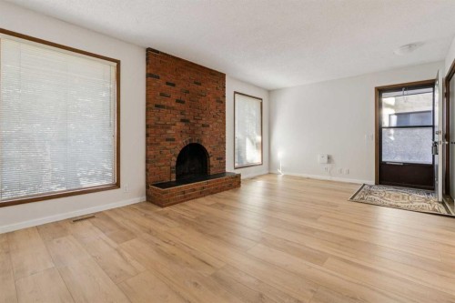 91 Edgehill Drive Nw, Calgary, AB - Indoor Photo Showing Living Room With Fireplace