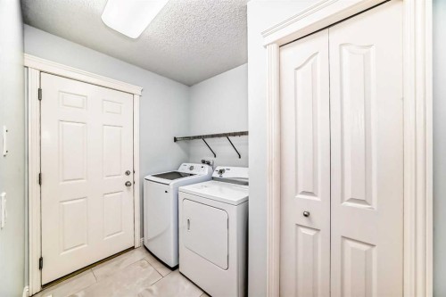 234 Panatella Boulevard Nw, Calgary, AB - Indoor Photo Showing Laundry Room