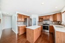 234 Panatella Boulevard Nw, Calgary, AB  - Indoor Photo Showing Kitchen With Double Sink 