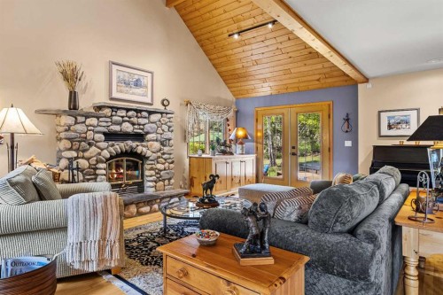216 Bow River Drive, Harvie Heights, AB - Indoor Photo Showing Living Room With Fireplace
