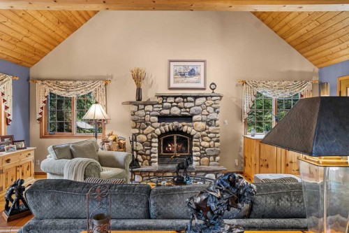 216 Bow River Drive, Harvie Heights, AB - Indoor Photo Showing Living Room With Fireplace