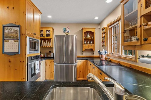 216 Bow River Drive, Harvie Heights, AB - Indoor Photo Showing Kitchen With Double Sink