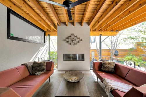 1707 Suffolk Street Sw, Calgary, AB - Indoor Photo Showing Living Room With Fireplace