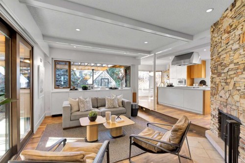 1707 Suffolk Street Sw, Calgary, AB - Indoor Photo Showing Living Room With Fireplace