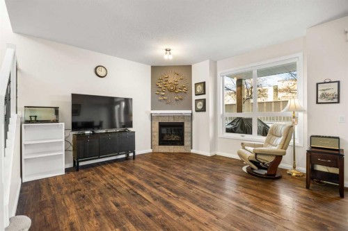 156 Royal Manor Nw, Calgary, AB - Indoor Photo Showing Living Room With Fireplace