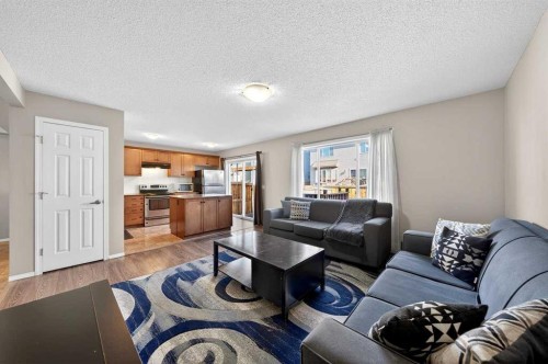 899 Windhaven Close Sw, Airdrie, AB - Indoor Photo Showing Living Room