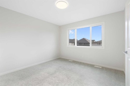 688 Buffaloberry Manor Se, Calgary, AB - Indoor Photo Showing Other Room