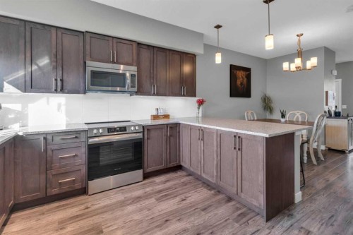 594 Hillcrest Road Sw, Airdrie, AB - Indoor Photo Showing Kitchen With Stainless Steel Kitchen With Upgraded Kitchen