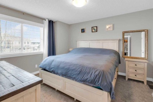 594 Hillcrest Road Sw, Airdrie, AB - Indoor Photo Showing Bedroom