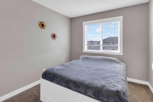 594 Hillcrest Road Sw, Airdrie, AB - Indoor Photo Showing Bedroom