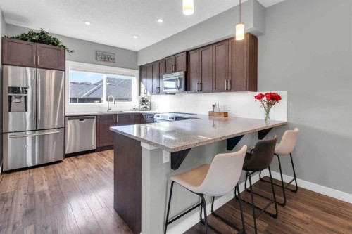 594 Hillcrest Road Sw, Airdrie, AB - Indoor Photo Showing Kitchen With Stainless Steel Kitchen