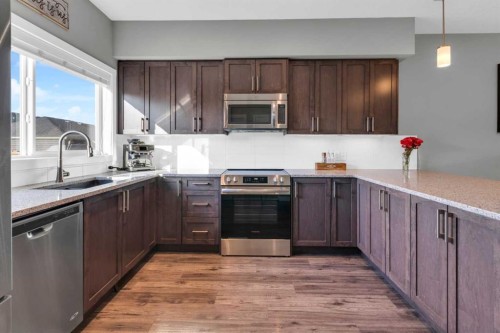 594 Hillcrest Road Sw, Airdrie, AB - Indoor Photo Showing Kitchen With Stainless Steel Kitchen