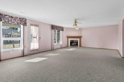 222 Arbour Cliff Close Nw, Calgary, AB - Indoor With Fireplace