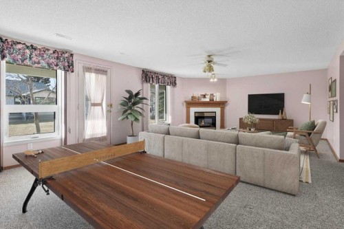 222 Arbour Cliff Close Nw, Calgary, AB - Indoor Photo Showing Living Room With Fireplace