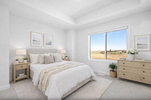 703-280 Chelsea Road, Chestermere, AB - Indoor Photo Showing Bedroom