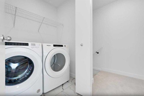703-280 Chelsea Road, Chestermere, AB - Indoor Photo Showing Laundry Room