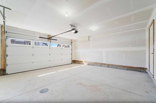 703-280 Chelsea Road, Chestermere, AB - Indoor Photo Showing Garage