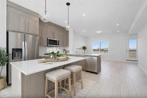 703-280 Chelsea Road, Chestermere, AB - Indoor Photo Showing Kitchen With Stainless Steel Kitchen With Upgraded Kitchen