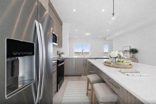 703-280 Chelsea Road, Chestermere, AB - Indoor Photo Showing Kitchen With Stainless Steel Kitchen With Upgraded Kitchen