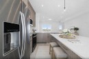 703-280 Chelsea Road, Chestermere, AB  - Indoor Photo Showing Kitchen With Stainless Steel Kitchen With Upgraded Kitchen 
