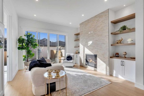 4525 20 Avenue Nw, Calgary, AB - Indoor Photo Showing Living Room With Fireplace