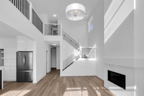 140 Copperhead Road Se, Calgary, AB - Indoor Photo Showing Other Room With Fireplace