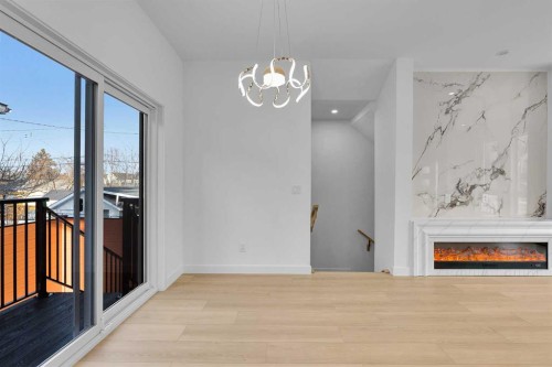 2605 1 Street Ne, Calgary, AB - Indoor Photo Showing Other Room With Fireplace
