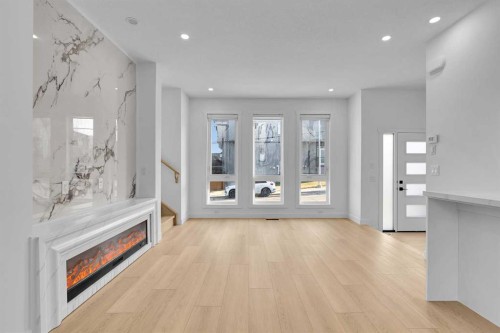 2605 1 Street Ne, Calgary, AB - Indoor Photo Showing Other Room With Fireplace