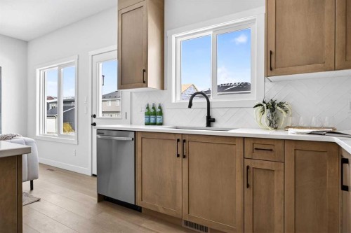 52 Fireside Common Sw, Cochrane, AB - Indoor Photo Showing Kitchen With Upgraded Kitchen