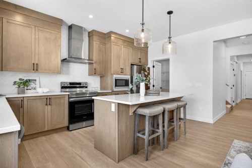 52 Fireside Common Sw, Cochrane, AB - Indoor Photo Showing Kitchen With Upgraded Kitchen