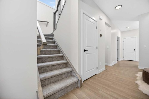 52 Fireside Common Sw, Cochrane, AB - Indoor Photo Showing Other Room