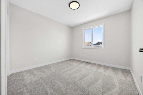 52 Fireside Common Sw, Cochrane, AB - Indoor Photo Showing Other Room