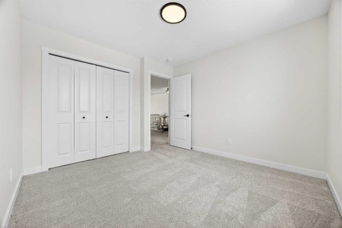 52 Fireside Common Sw, Cochrane, AB - Indoor Photo Showing Other Room
