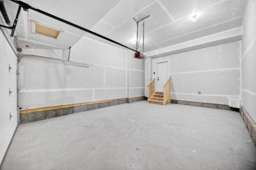 52 Fireside Common Sw, Cochrane, AB - Indoor Photo Showing Garage