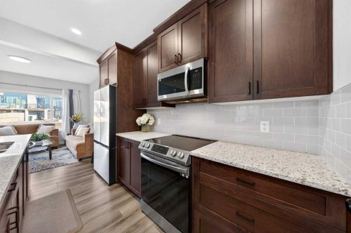 148 Highview Gate Se, Airdrie, AB - Indoor Photo Showing Kitchen With Upgraded Kitchen
