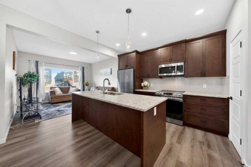 148 Highview Gate Se, Airdrie, AB - Indoor Photo Showing Kitchen With Double Sink With Upgraded Kitchen
