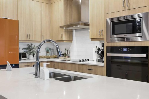 128 Setonstone Gardens Se, Calgary, AB - Indoor Photo Showing Kitchen With Double Sink With Upgraded Kitchen