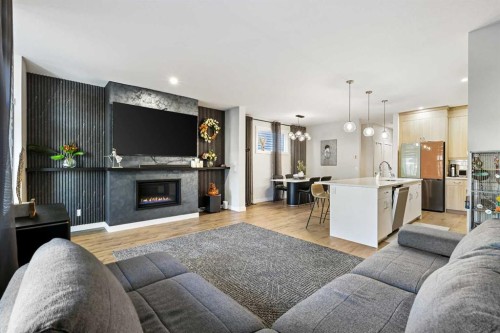 128 Setonstone Gardens Se, Calgary, AB - Indoor Photo Showing Living Room With Fireplace