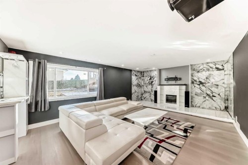 305 Lakeside Greens Crescent, Chestermere, AB - Indoor Photo Showing Living Room With Fireplace