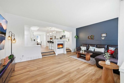 41 New Brighton Green Se, Calgary, AB - Indoor Photo Showing Living Room With Fireplace