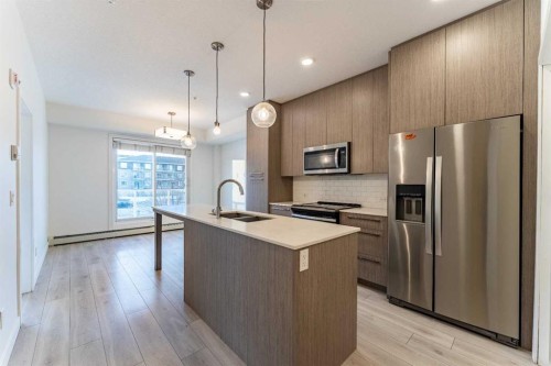 2205-76 Cornerstone Passage Ne, Calgary, AB - Indoor Photo Showing Kitchen With Stainless Steel Kitchen With Double Sink With Upgraded Kitchen