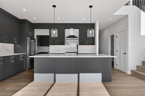 709 Dawson Place, Chestermere, AB - Indoor Photo Showing Kitchen With Upgraded Kitchen