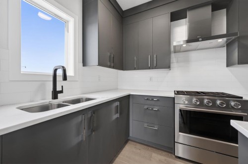 709 Dawson Place, Chestermere, AB - Indoor Photo Showing Kitchen With Double Sink With Upgraded Kitchen