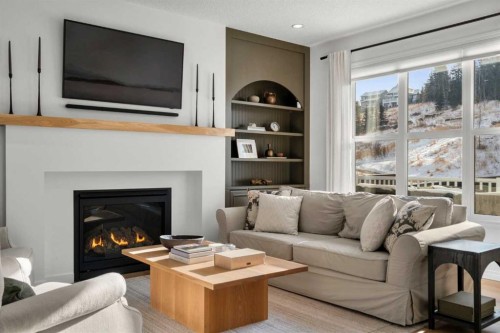 57 Riviera Crescent, Cochrane, AB - Indoor Photo Showing Living Room With Fireplace