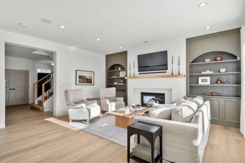 57 Riviera Crescent, Cochrane, AB - Indoor Photo Showing Living Room With Fireplace