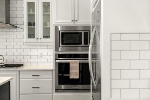 57 Riviera Crescent, Cochrane, AB - Indoor Photo Showing Kitchen